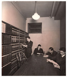 Four students in law library by University of Pittsburgh School of Law