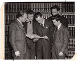 Group of law students reading book by University of Pittsburgh School of Law