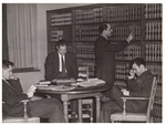 Students reading books in law library by University of Pittsburgh School of Law