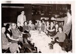 Roz and David at dinner with friends (Souvenir Photograph Lenny Litman's COPA 818 liberty ave Pittsburgh PA by Harry Litman