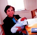 Roz holding grandchild by Harry LItman